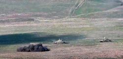 In this image taken from a footage released by Armenian Defense Ministry on Sunday, Sept. 27, 2020, Armenian army destroys Azerbaijani tanks at the contact line of the self-proclaimed Republic of Nagorno-Karabakh, Azerbaijan. Fighting between Armenia and Azerbaijan has broken out around the separatist region of Nagorno-Karabakh and the Armenian Defense Ministry says two Azerbaijani helicopters have been shot down. Ministry spokeswoman Shushan Stepanyan also said Armenian forces hit three Azerbaijani tanks. (Armenian Defense Ministry via AP)