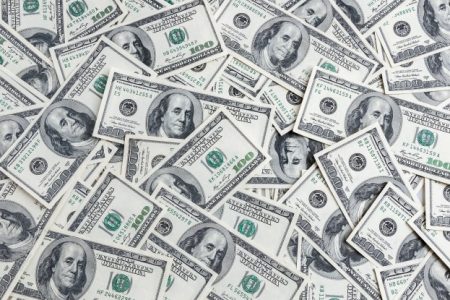 background-hundred-dollars-scattered-table_76263-6