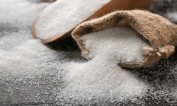 Sack with pure sugar on table