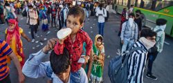 Ghaziabad: Migrants wait to board buses to their native villages during a nationwide lockdown, imposed in the wake of coronavirus pandemic at Kaushambi, in Ghaziabad, Saturday, March 28, 2020. (PTI Photo/Manvender Vashist)(PTI28-03-2020_000311A)