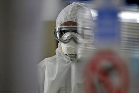 A technician tests swabs from patients for COVID-19 infection at the Central Health Laboratory in the Yemeni capital Sanaa, amid the novel coronavirus pandemic, on April 11, 2020. - Yemen reported its first case of coronavirus yesterday in a southern government-controlled province, raising fears of an outbreak in the war-torn country as air strikes blamed on the Saudi-led coalition tested a unilateral truce. (Photo by MOHAMMED HUWAIS / AFP)