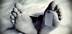 dead body with a blank toe tag, in monochrome
