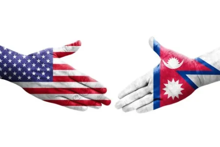 depositphotos_616926268-stock-photo-handshake-nepal-usa-flags-painted