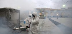 Members of the medical team spray disinfectant to sanitize outdoor place of Imam Reza's holy shrine, following the coronavirus outbreak, in Mashhad, Iran February 27, 2020. Picture taken February 27, 2020. WANA (West Asia News Agency) via REUTERS ATTENTION EDITORS - THIS PICTURE WAS PROVIDED BY A THIRD PARTY