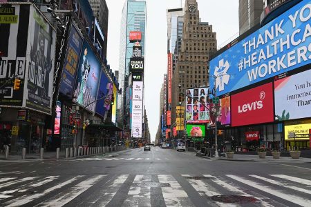 View of an almost empty Time Square on April 03, 2020 in New York. - In New York, the epicenter of the US outbreak, Mayor Bill de Blasio urged residents to cover their faces when outside and Vice President Mike Pence said there would be a recommendation on the use of masks by the general public in the next few days. (Photo by Angela Weiss / AFP) (Photo by ANGELA WEISS/AFP via Getty Images)