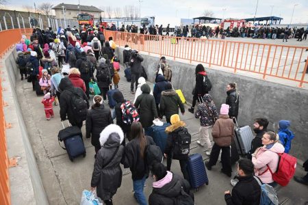 People coming from Ukraine descend from a ferry boat to enter Romania after crossing the Danube river at the Isaccea-Orlivka border crossing between Romania and Ukraine on February 26, 2022, as Ukrainians flee their country following Russia's invasion of Ukraine. (Photo by Daniel MIHAILESCU / AFP) (Photo by DANIEL MIHAILESCU/AFP via Getty Images)