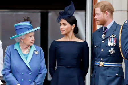 LONDON, UNITED KINGDOM - JULY 10: (EMBARGOED FOR PUBLICATION IN UK NEWSPAPERS UNTIL 24 HOURS AFTER CREATE DATE AND TIME) Queen Elizabeth II, Meghan, Duchess of Sussex and Prince Harry, Duke of Sussex watch a flypast to mark the centenary of the Royal Air Force from the balcony of Buckingham Palace on July 10, 2018 in London, England. The 100th birthday of the RAF, which was founded on on 1 April 1918, was marked with a centenary parade with the presentation of a new Queen's Colour and flypast of 100 aircraft over Buckingham Palace. (Photo by Max Mumby/Indigo/Getty Images)