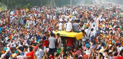 Farmers gesture as they block a national highway during a protest against farm bills passed by India's parliament, in Shambhu in the northern state of Punjab, India, September 25, 2020. REUTERS/Adnan Abidi