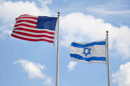 United States & Israeli flags wave together in unison symbolizing concepts such as the American/Israeli bond and Judaism in America. Here are some related images: