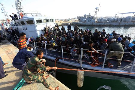 Illegal migrants of different African nationalities arrive at a naval base in the capital Tripoli on April 22, 2018, after they were rescued off the coast of Zlitan from two inflatable boats.
At least eleven migrants died at sea and another 263 were rescued in two separate operations off the coast of Libya, the country's navy said. / AFP PHOTO / MAHMUD TURKIA