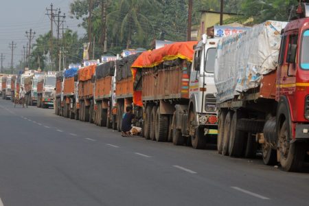 Indian trucks loaded with goods are seen parked near the India-Nepal border at Panitanki on November 5, 2015. Nepalese police have tried to forcibly break up a border blockade on the Nepalese side of the border that was set up by activists angry over a new constitution, which has led to crippling fuel shortages and cut off access to other vital supplies in the landlocked Himalayan nation.  AFP PHOTO/Diptendu DUTTA        (Photo credit should read DIPTENDU DUTTA/AFP/Getty Images)