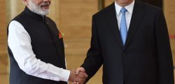 In this photo released by the Indian Ministry of External Affairs, Indian Prime Minister Narendra Modi, left, shakes hands with Chinese President Xi Jinping in Wuhan, China, Friday, April 27, 2018. The leaders of India and China met at a lakeside resort in central China on Friday amid tensions along their contested border and a rivalry for influence among their smaller neighbors that could determine dominance in Asia. (Indian Ministry of External Affairs via AP)