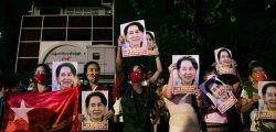 Supporters of the National League for Democracy (NLD) party hold portraits of Aung San Suu Kyi as they celebrate in front of the party's headquarters in Yangon on November 9, 2020, as NLD officials said they were confident of a landslide victory in the weekend's election. - Aung San Suu Kyi's ruling National League for Democracy said on November 9, 2020, it was confident of winning a landslide victory in Myanmar as official results trickled in following the weekend's coronavirus-disrupted election. Millions had lined up for hours to cast their ballots on November 8, 2020 -- only the second national election since the country emerged from outright military rule in 2011. (Photo by Sai Aung Main / AFP) (Photo by SAI AUNG MAIN/AFP via Getty Images)