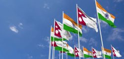 nepal-and-india-flags-waving-together-in-the-sky-seamless-loop-in-wind-space-on-left-side-for-design-or-information-3d-rendering-free-video