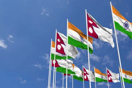 nepal-and-india-flags-waving-together-in-the-sky-seamless-loop-in-wind-space-on-left-side-for-design-or-information-3d-rendering-free-video