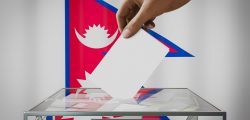nepal-flag-hand-dropping-ballot-card-into-box-voting-election-concept_SM_Blog_Jan_2023-scaled