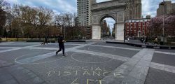 People walk around Washington square park as the coronavirus disease (COVID-19) outbreak continues in New York, U.S., March 22, 2020.  REUTERS/Eduardo Munoz