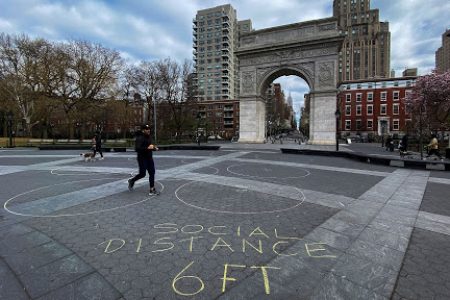 People walk around Washington square park as the coronavirus disease (COVID-19) outbreak continues in New York, U.S., March 22, 2020.  REUTERS/Eduardo Munoz