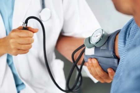 Ensuring her vitals are nominal before the procedure