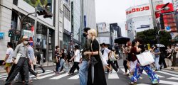 People walk at a shopping area of Shinjuku during the state of emergency in Tokyo, Japan, July 26, 2021. REUTERS/Androniki Christodoulou