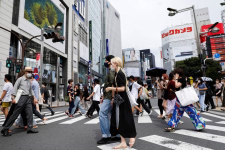 People walk at a shopping area of Shinjuku during the state of emergency in Tokyo, Japan, July 26, 2021. REUTERS/Androniki Christodoulou