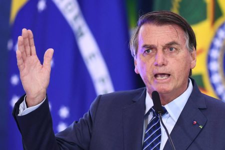 (FILES) In this file photo Brazilian President Jair Bolsonaro speaks during the launching event of the Week of Communication at the Planalto Palace in Brasilia, on May 5, 2021. - Brazilian President Jair Bolsonaro has seen happier days: his poll numbers have plunged, his nemesis Luiz Inacio Lula da Silva is looming large and the Senate is investigating his chaotic handling of Covid-19. What to do?
First: Hop on his trusty blue motorcycle and lead a huge rally of fellow far-right bikers, as he did last May 9, 2021. Second: Ride in on horseback to fire up a demo of conservative farmers, as he reportedly plans to do May 15, 2021.That rally's organizers have called for conservative "soldiers" to protest the "craziness" of pandemic stay-at-home measures and Brazil's Supreme Court, which allowed local authorities to impose such policies over Bolsonaro's objections. (Photo by EVARISTO SA / AFP)