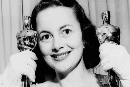 Olivia de Havilland holds her two Academy Award statues at her home March  24, 1950, after the Academy Awards ceremonies.   She won that year for her performance in "The Heiress."  She had won before, in 1946, for "To Each His Own." (AP Photo)