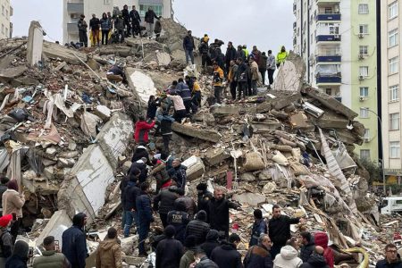 ADANA, TURKIYE - FEBRUARY 06: A person is rescued from the wreckage of a building during search and rescue efforts after a 7.4 magnitude earthquake hit southern provinces of Turkiye, in Adana, Turkiye on February 6, 2023. The 7.4 magnitude earthquake jolted Turkiye's southern province of Kahramanmaras early Monday, according to Turkiye's Disaster and Emergency Management Authority (AFAD). It was followed by a magnitude 6.4 quake that struck southeastern Gaziantep province. A third earthquake with a 6.5 magnitude also hit Gaziantep. Earthquakes had affected several provinces including, Osmaniye, Malatya, Adiyaman, Adana, Diyarbakir, Kilis and Sanliurfa. (Photo by Eren Bozkurt/Anadolu Agency via Getty Images)