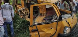 Onlookers gather around the mangled remains of a school bus after it was hit by a train in Kushinagar district in India's Uttar Pradesh state on April 26, 2018.
At least 13 children were killed and five critically injured April 26 after a train smashed into a small school bus in northern India, an official said.
 / AFP PHOTO / -
