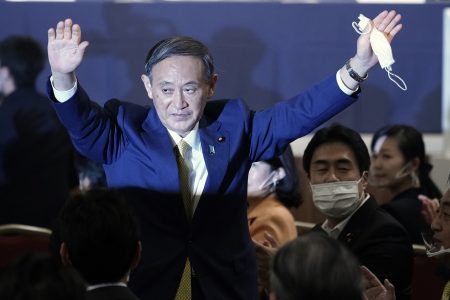 TOKYO, JAPAN - SEPTEMBER 14:  Japanese Chief Cabinet Secretary Yoshihide Suga acknowledges as he is elected as new head of Japanâ€™s ruling party at the Liberal Democratic Party's (LDP) leadership election on September 14, 2020 in Tokyo, Japan.  (Photo by Eugene Hoshiko - Pool/Getty Images)