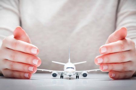 travel-insurance-hands-plane