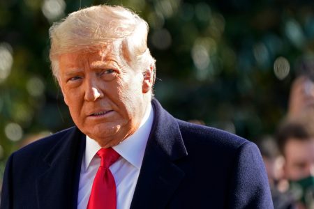 FILE - President Donald Trump walks to board Marine One on the South Lawn of the White House on Jan. 12, 2021, in Washington. Media critic Brian Stelter is updating his book "Hoax: Donald Trump, Fox News and the Dangerous Distortion of Truth" in preparation for the paperback edition. The changes reflect the end of Trump's presidency and the false claims of voter fraud and the rise of Tucker Carlson to become Fox's most prominent personality. Announced on Sunday, Feb, 21, 2021, the revised edition will be released in June. (AP Photo/Gerald Herbert, File )