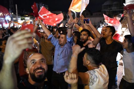 (180624) -- ISTANBUL, June 24, 2018 (Xinhua) -- Turkish President Recep Tayyip Erdogan's supporters celebrate on Taksim Square in Istanbul, Turkey, on June 24, 2018. The preliminary partial results showed Turkey's incumbent President Recep Tayyip Erdogan won 52.7 percent in the presidential race with 96 percent of votes counted, state-run Anadolu Agency said Sunday. (Xinhua/Wu Huiwo)