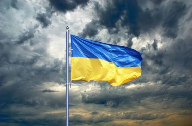 Ukraine flag. Ukrainian flag on black storm cloud sky. stormy weather