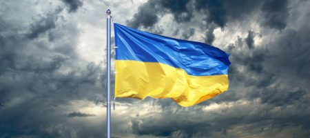 Ukraine flag. Ukrainian flag on black storm cloud sky. stormy weather