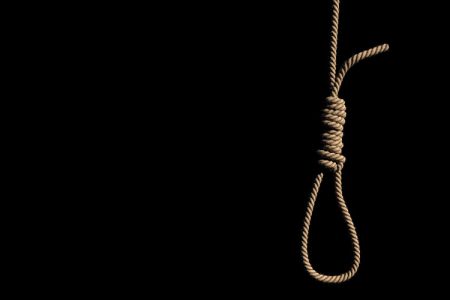 A fabric low poly suicide rope with slipknot placed on the white concrete wall with white space on left. 3D illustration and rendered by program Blender.