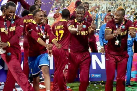 Kolkata: West Indies Captain D Sammy with teammates and trophy celebrates after beating England in the ICC World T20 final match at the Eden Gardens in Kolkata on Sunday. PTI Photo by Swapan Mahapatra       (PTI4_3_2016_000324b)