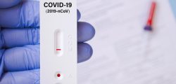 Positive test result by using rapid test for COVID-19, quick fast antibody point of care testing.