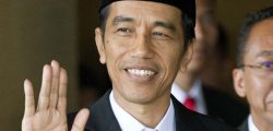 Joko Widodo waves ahead of his swearing in as Indonesia's seventh president at Parliament in Jakarta, Indonesia, Monday, Oct. 20, 2014. (AP Photo/Mark Baker)
