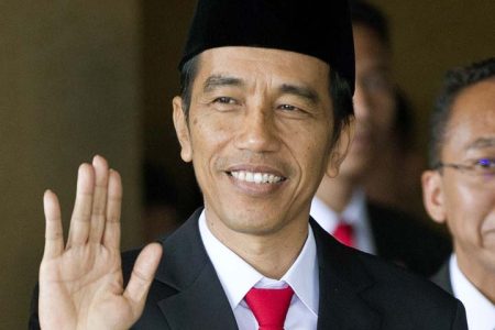 Joko Widodo waves ahead of his swearing in as Indonesia's seventh president at Parliament in Jakarta, Indonesia, Monday, Oct. 20, 2014. (AP Photo/Mark Baker)