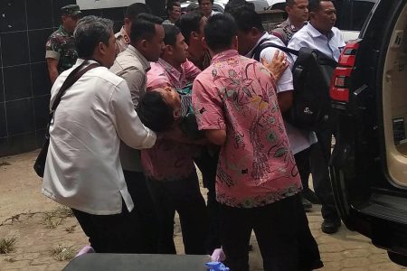 Indonesia's Chief Security Minister Wiranto is being carried from a car to emergency room after he was attacked in Pandeglang, Banten province, Indonesia, October 10, 2019 in this photo taken by Antara Foto.  Antara Foto/Weli Ayu Rejeki/ via REUTERS ATTENTION EDITORS - THIS IMAGE WAS PROVIDED BY A THIRD PARTY. MANDATORY CREDIT. INDONESIA OUT.