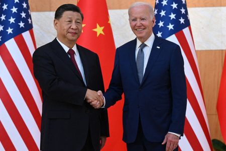 US President Joe Biden (R) and China's President Xi Jinping (L) shakes hands as they meet on the sidelines of the G20 Summit in Nusa Dua on the Indonesian resort island of Bali on November 14, 2022. (Photo by SAUL LOEB / AFP) (Photo by SAUL LOEB/AFP via Getty Images)